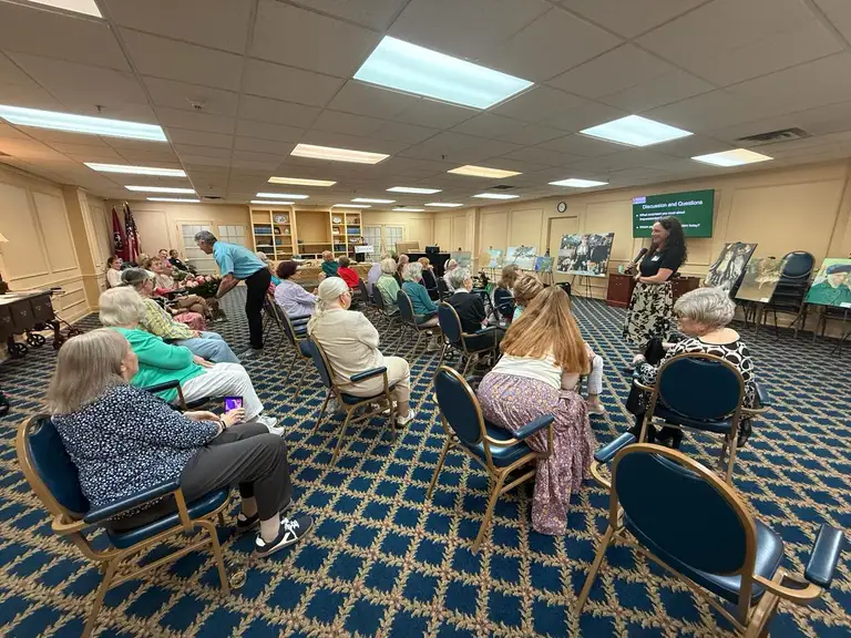 Assisted living residents enjoying the magic of art!